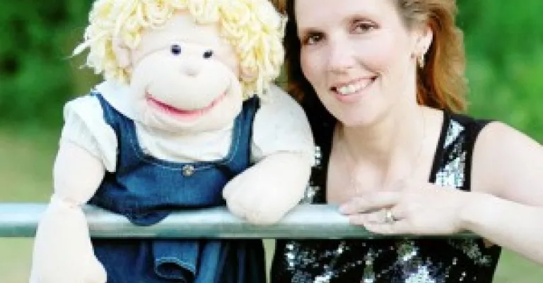 Woman holding a puppet