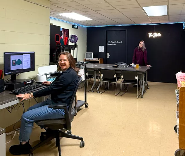 The Landon Studio with a staff member sitting at a computer desk in the space.