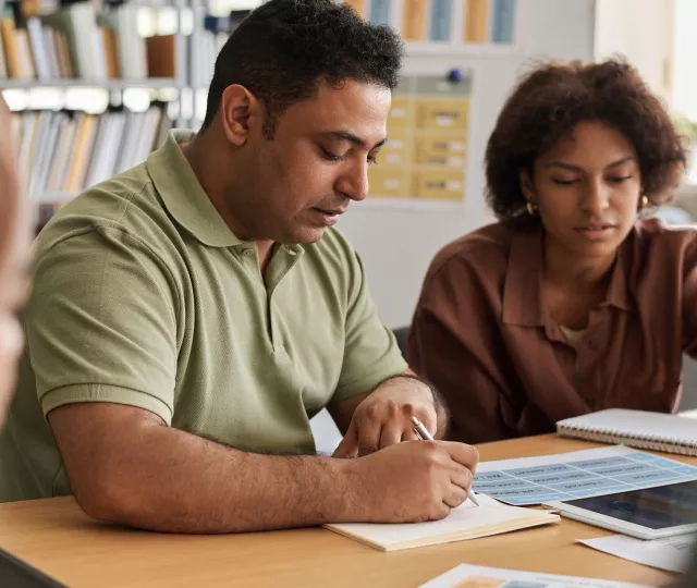 2 people at a study table learning together