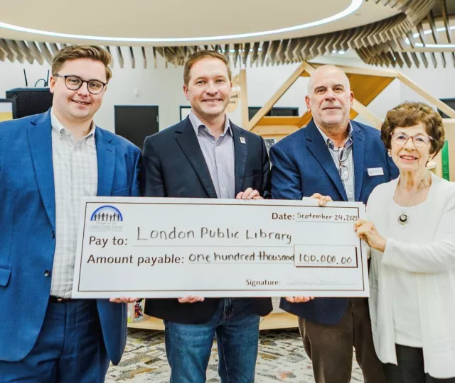 Library Board Chair, Mayor Josh Morgan, Library CEO and Friends President hold cheque for $100,000 in Sherwood Branch Library