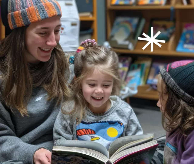 Parent and children wearing winter hats in the library enjoying a book 