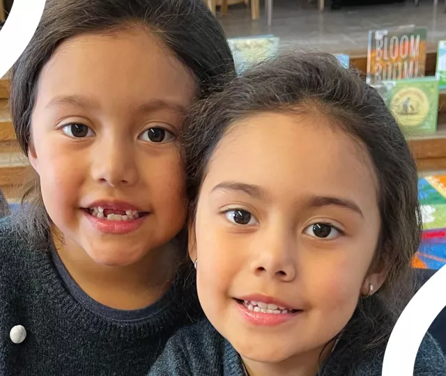 Two little kids having fun at the library during March Break 