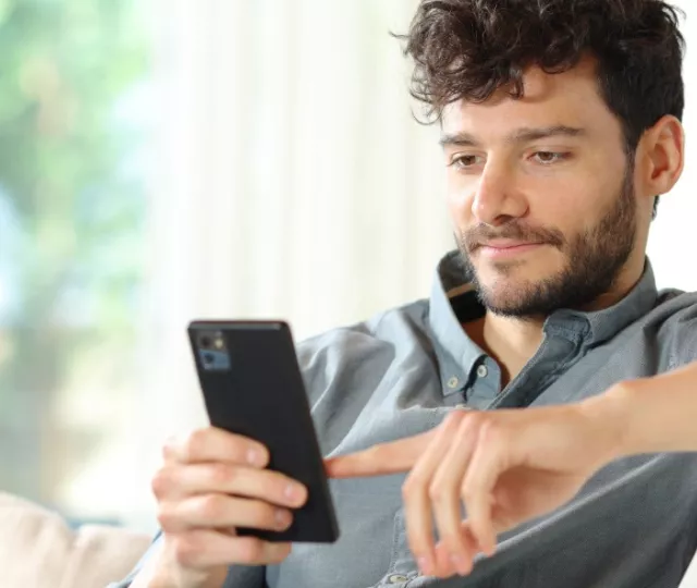 Person reading book on smart phone
