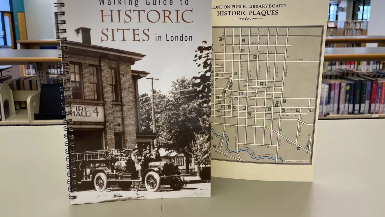 Photo of the Walking Guide to Historic Sites in London with a map visible in the background.