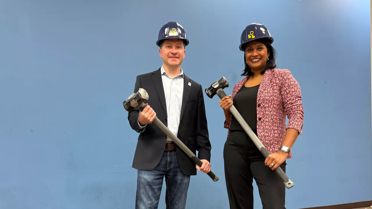 Ward 7 Councillor Corrine Rahman and Mayor Josh Morgan hold sledgehammers at Sherwood library.