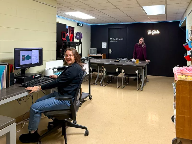 The Landon Studio with a staff member sitting at a computer desk in the space.