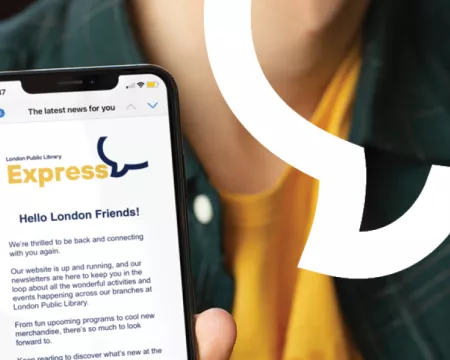A person holds up a phone showing London Public Library's newsletter in their email.