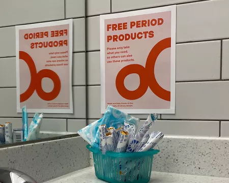 Free Period Products display in bathroom.