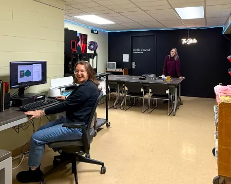 The Landon Studio with a staff member sitting at a computer desk in the space.