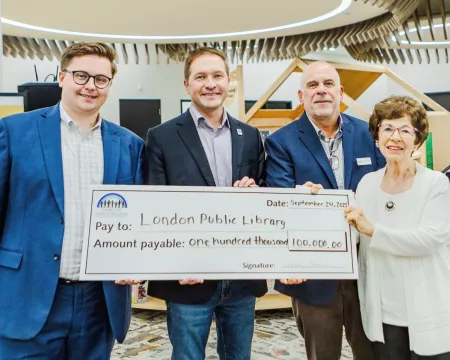 Library Board Chair, Mayor Josh Morgan, Library CEO and Friends President hold cheque for $100,000 in Sherwood Branch Library