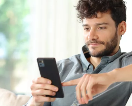 Person reading book on smart phone