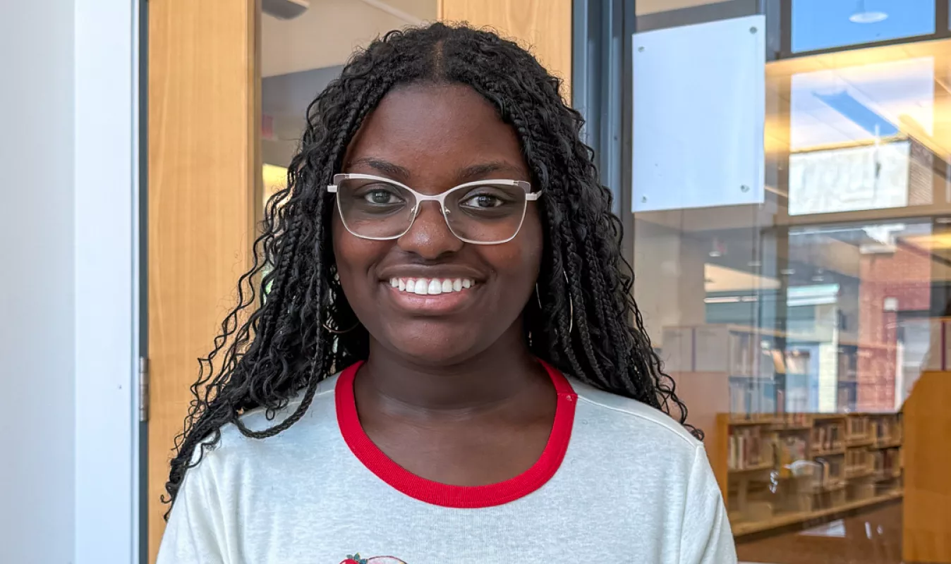 Young high school woman wearing glasses in a study room