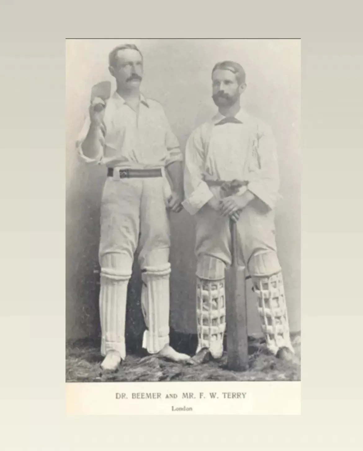 Black and white photo of two men in white cricket uniforms and holding cricket bats. Text on photo Dr. Beemer and Mr. F.W. Terry London